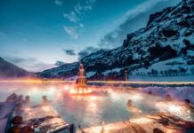 Nella Valle di Saas e alle terme di Leukerbad per un weekend a tutto relax Tramonto invernale alla Leukerbad Therme, il più grande complesso termale alpino d'Europa